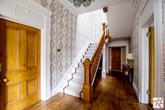 3200N 20 location in north yorkshire with traditional hallway featuring wooden flooring and wallpaper