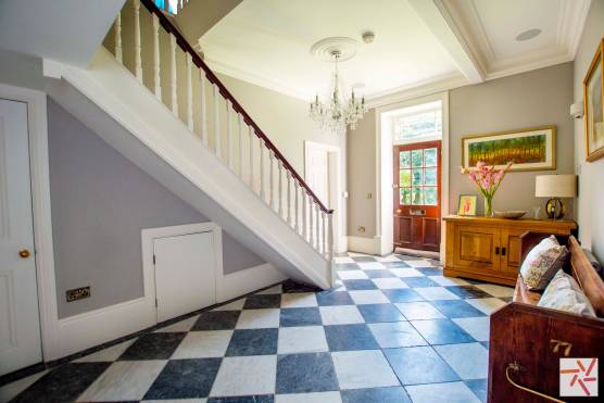 Location 3202W 11 photography location in west yorkshire large hallway with staircase and tiled flooring