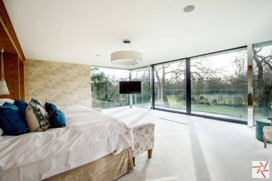 3225C 14 tv comemrcial location house in Cheshire large bedroom with feature windows.jpg