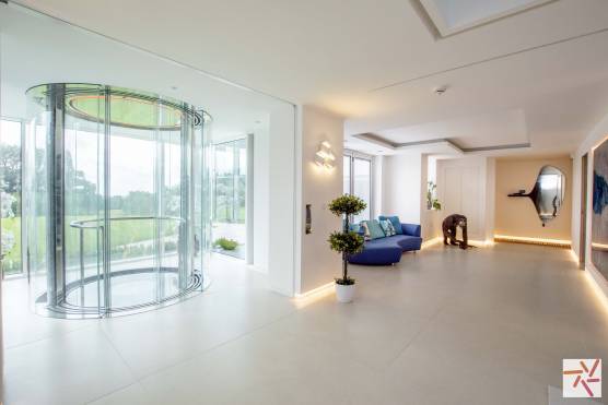 3244C 9 tv drama location house in Cheshire contemporary glass elevator and corridor.jpg