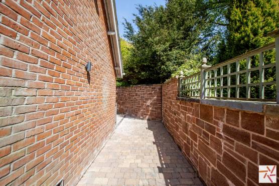 3245C 34 tv drama location house in Cheshire red brick wall and path.jpg