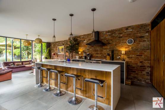 3256C 2 filming location house in Cheshire stylish open plan exposed brick kitchen with kitchen island.jpg