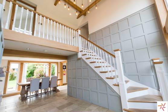 3279C 26 filming location house in Cheshire spacious entrance and staircase with pannelling.jpg