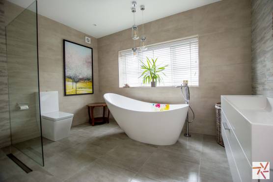 3280C 17 photo shoot location house in Cheshire contemporary tiled bathroom with modern bath and wet room shower.jpg