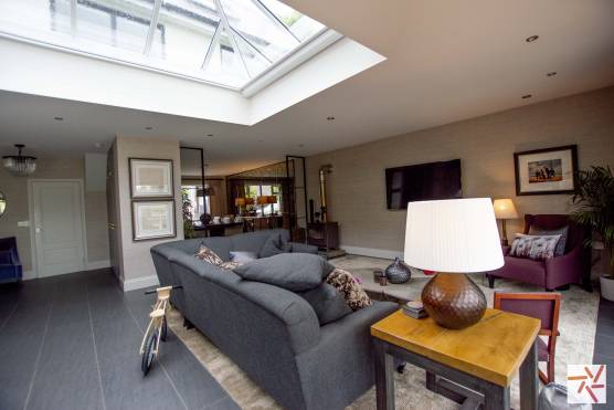 3280C 9 photo shoot location house in Cheshire spacious open plan living area with skylight and fireplace.jpg