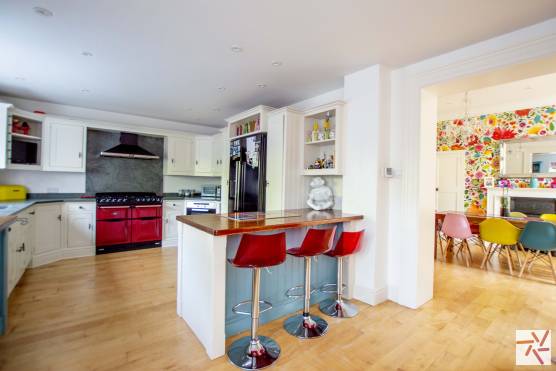 3290C 12 filming location house in Cheshire open plan kitchen and dining area with colourful features.jpg