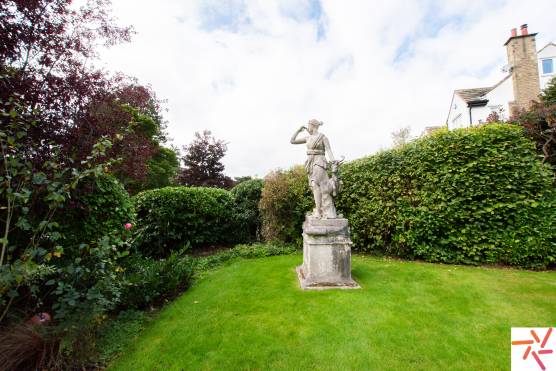 3297W 47 filming location house in west yorkshire family garden with statue.jpg