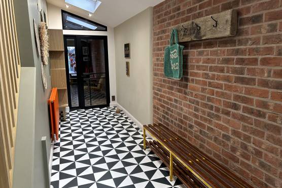 3315M 13 tv shoot location house in Manchester entrance hallway with exposed brick.jpeg