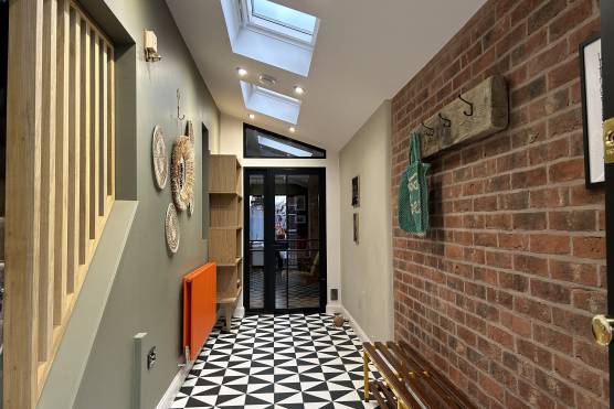 3315M 14 tv shoot location house in Manchester entrance hallway with exposed brick.jpeg