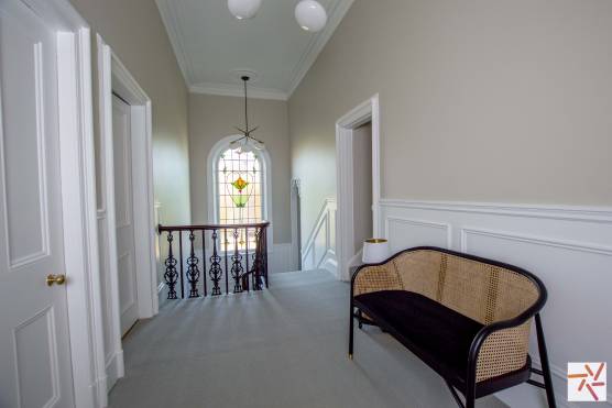 3319V 23 filming location house in Merseyside large open hallway with stained glass window