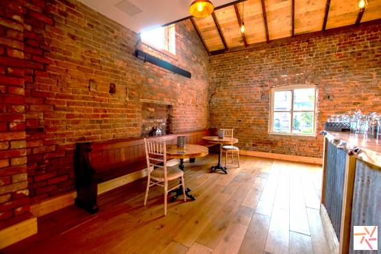 3338M 9 tv shoot location space in Manchester bar area with exposed brick and beams.jpg