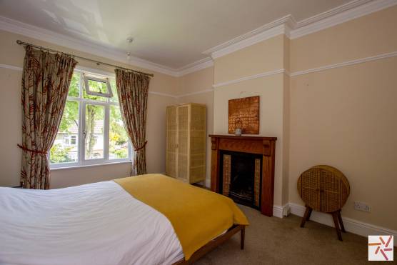 3454M 16 filming location house in Manchester large light bedroom with fireplace