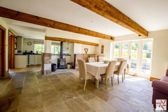 3347C 9 tv shoot location house in Cheshire traditional open plan kitchen and dining area with beams.jpg