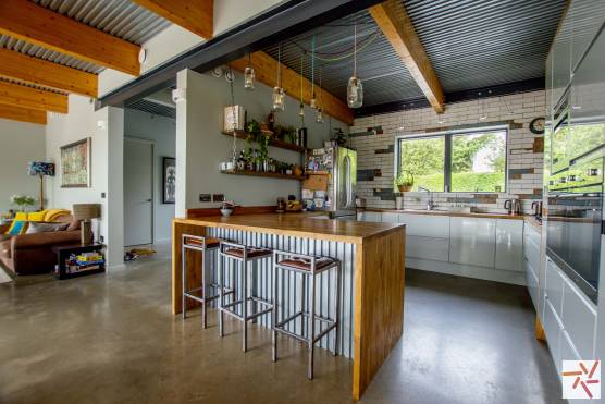 3362N 5 photo shoot location house in North Yorkshire rustic style kitchen with wooden beams and concete floor.jpg