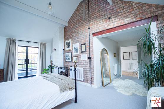 3382V 16 photo shoot location house in Merseyside family home with large bedroom with exposed brickwork