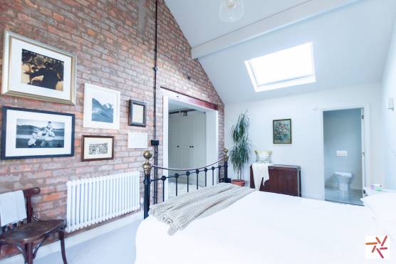 3382V 18 tv drama location house in Merseyside family home with large bedroom with exposed brickwork