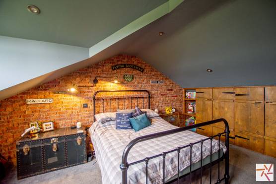 3389W 23 tv commercial location house in West Yorkshire large kids bedroom with brick wall