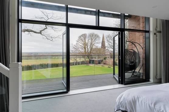 3452C 9 tv commercial location house in Cheshire large contemporary bedroom with balcony and rural views