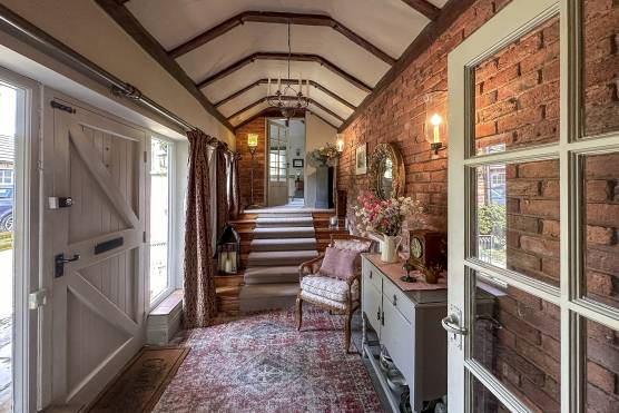 3492C 3 tv drama location house in Chesire entrance hallway with exposed brick and beams.jpg