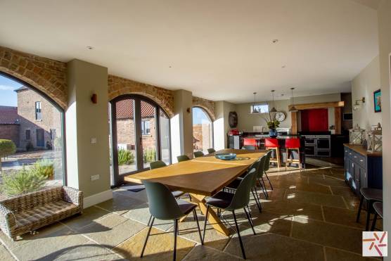 3266N-1-photo-shoot-location-house-in-North-Yorkshire-open-plan-kitchen-and-dining-area-barn-feature-windows.jpg